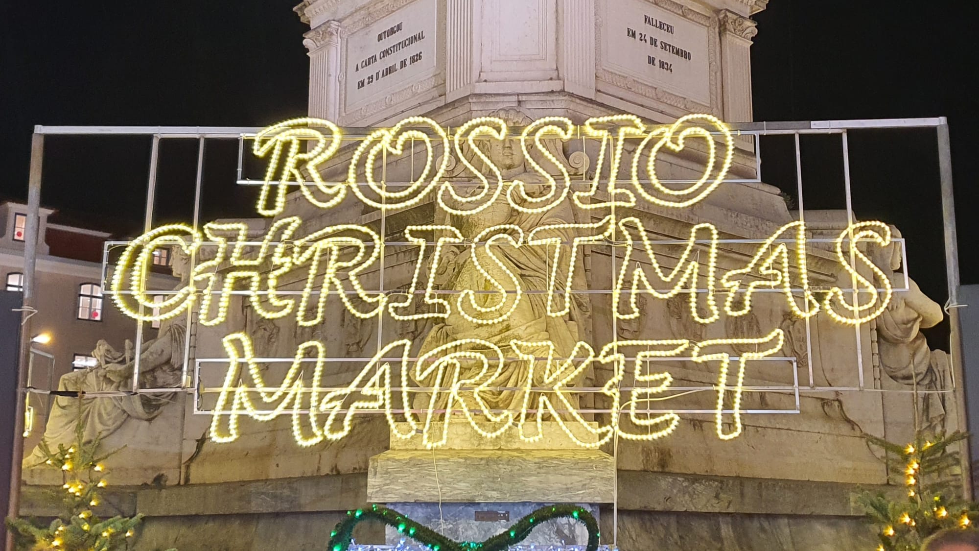 Rossio Christmas Market neon lights in Rossio Square, Lisbon, Portugal